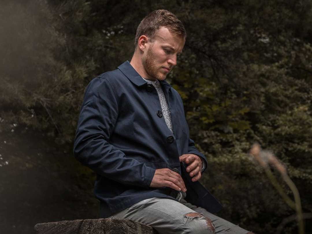 A young male model test driving the jacket in Saltram near the River Plym