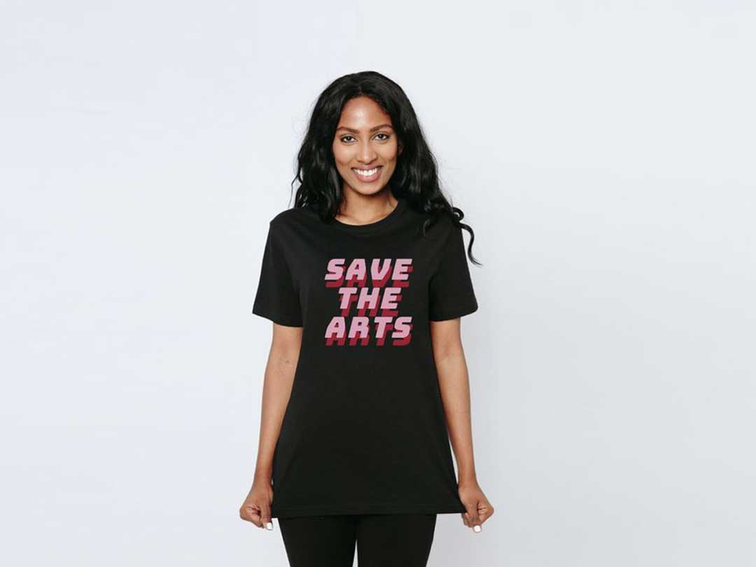 Young black female wearing a save the arts t-shirt